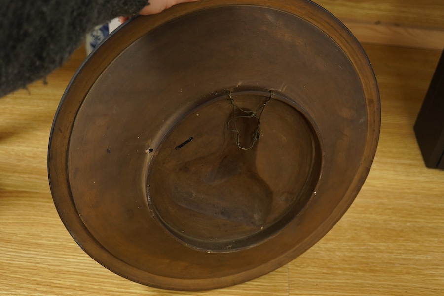 A Johann Maresch cold painted terracotta dish, decorated in relief with a Turk on horseback, 39cm in diameter. Condition - good, painted wood sword blade